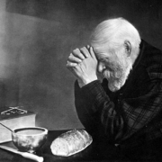 Grace is a photograph by Eric Enstrom. It depicts an elderly man (named Charles Wilden) with hands folded, saying a prayer over a table with a simple meal.