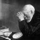 Grace is a photograph by Eric Enstrom. It depicts an elderly man (named Charles Wilden) with hands folded, saying a prayer over a table with a simple meal.